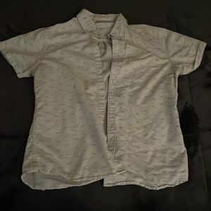 Steel & Jelly white, button up, collared, shark-printed shirt.